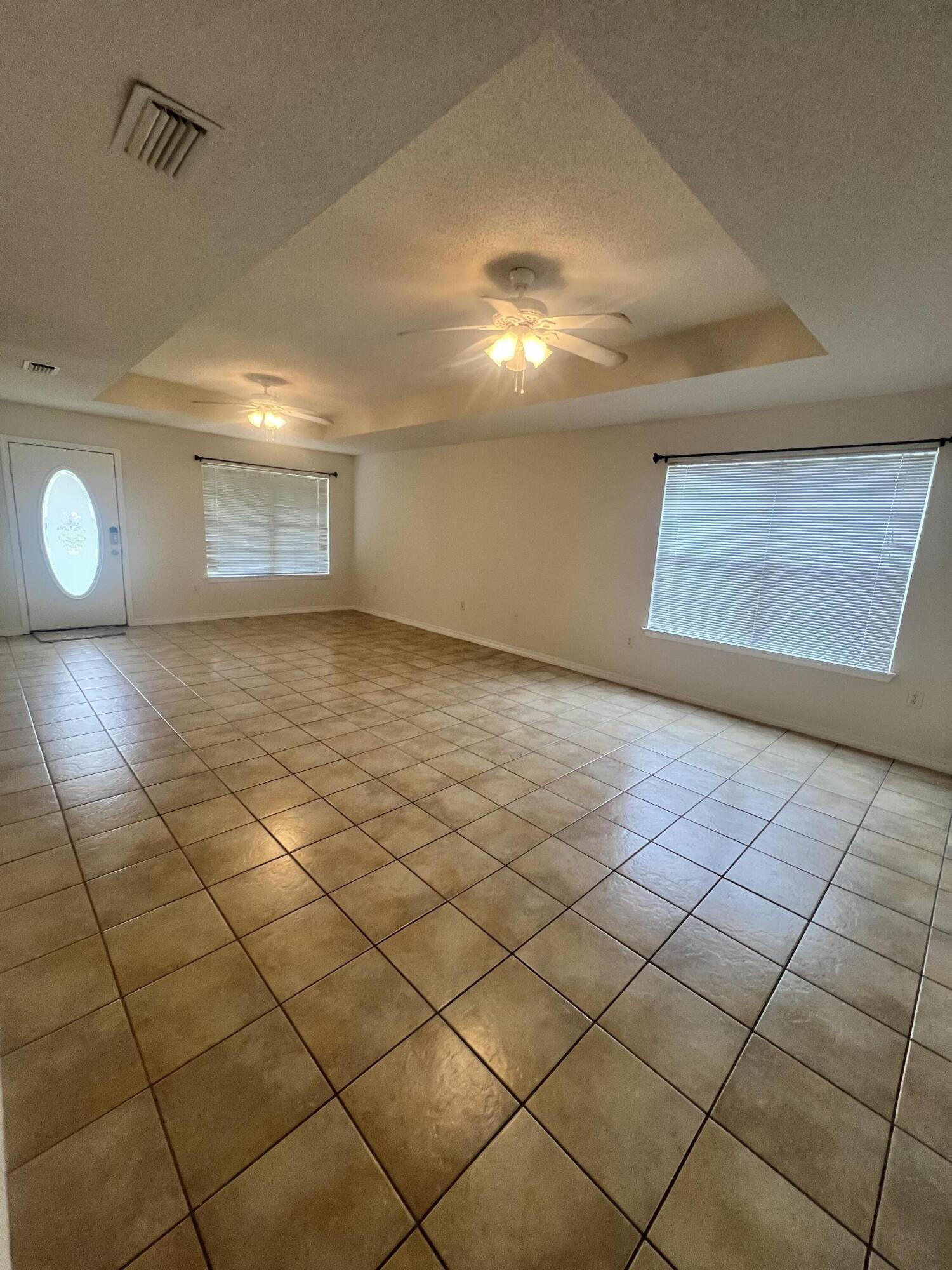 8 Howard Street Niceville, FL 32578 - Photo 11 of 22 a view of a livingroom and window
