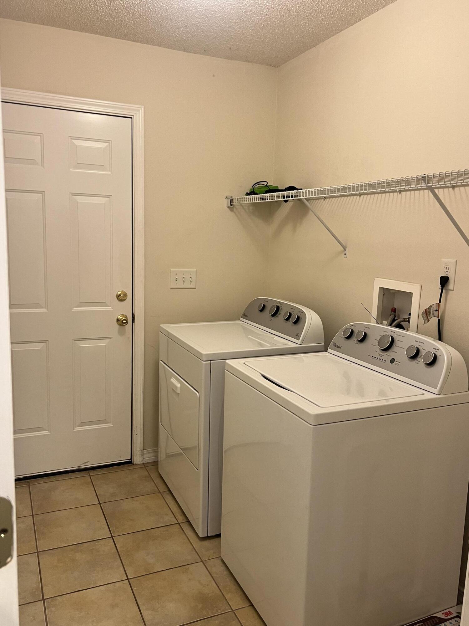 8 Howard Street Niceville, FL 32578 - Photo 15 of 22 a utility room with dryer and washer