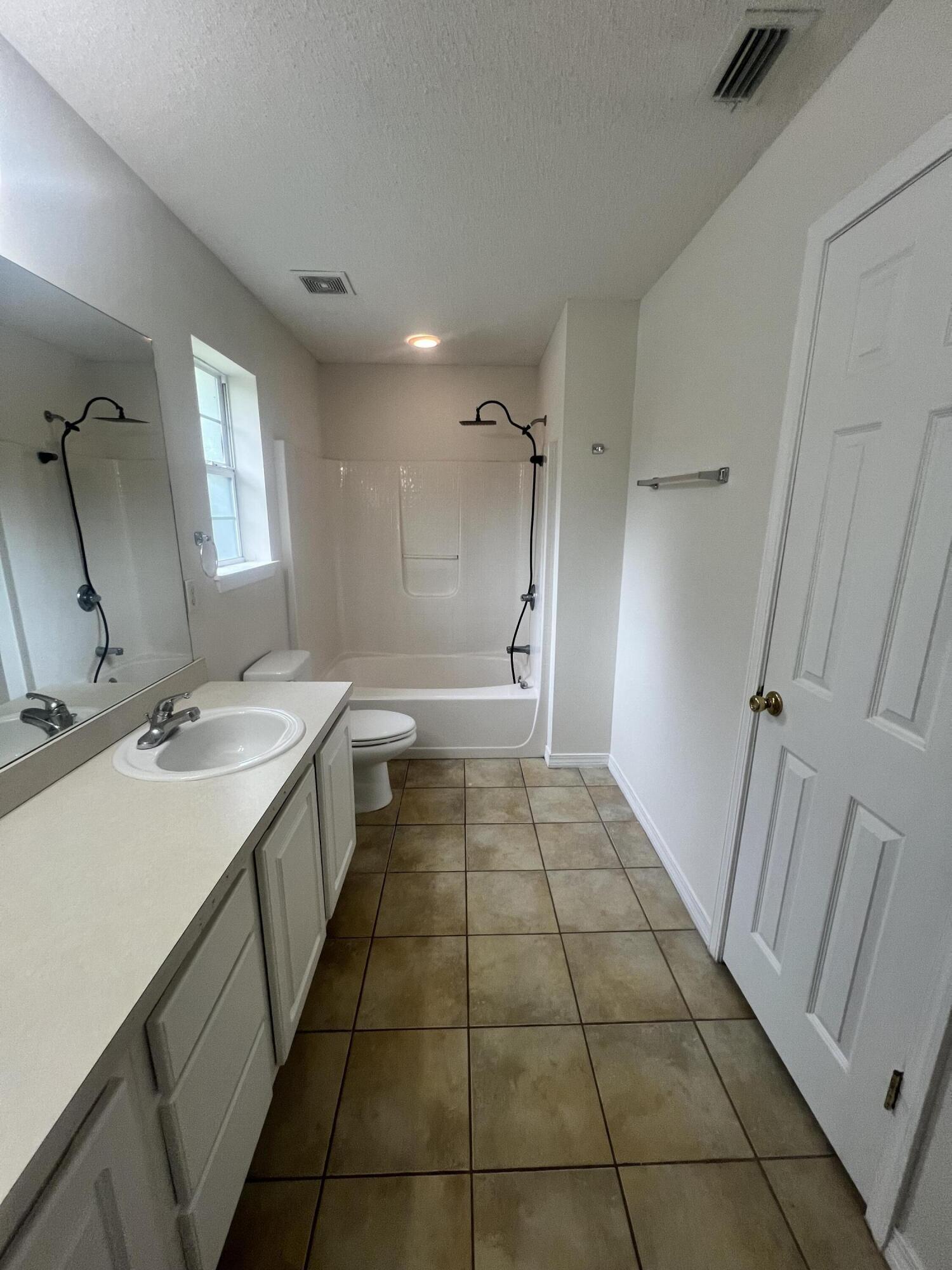 8 Howard Street Niceville, FL 32578 - Photo 19 of 22 a bathroom with a sink a toilet and a mirror