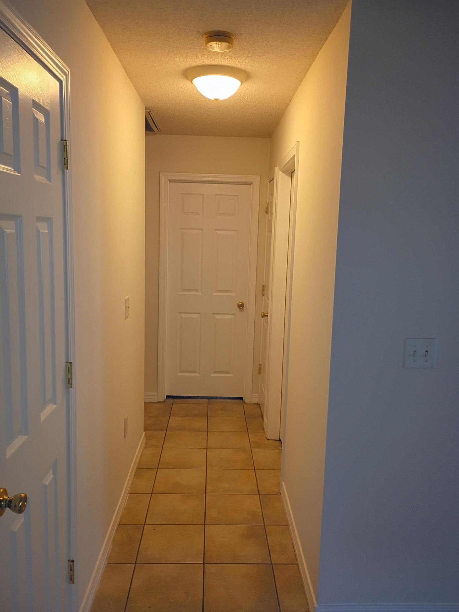 8 Howard Street Niceville, FL 32578 - Photo 5 of 22 a view of a hallway with a door