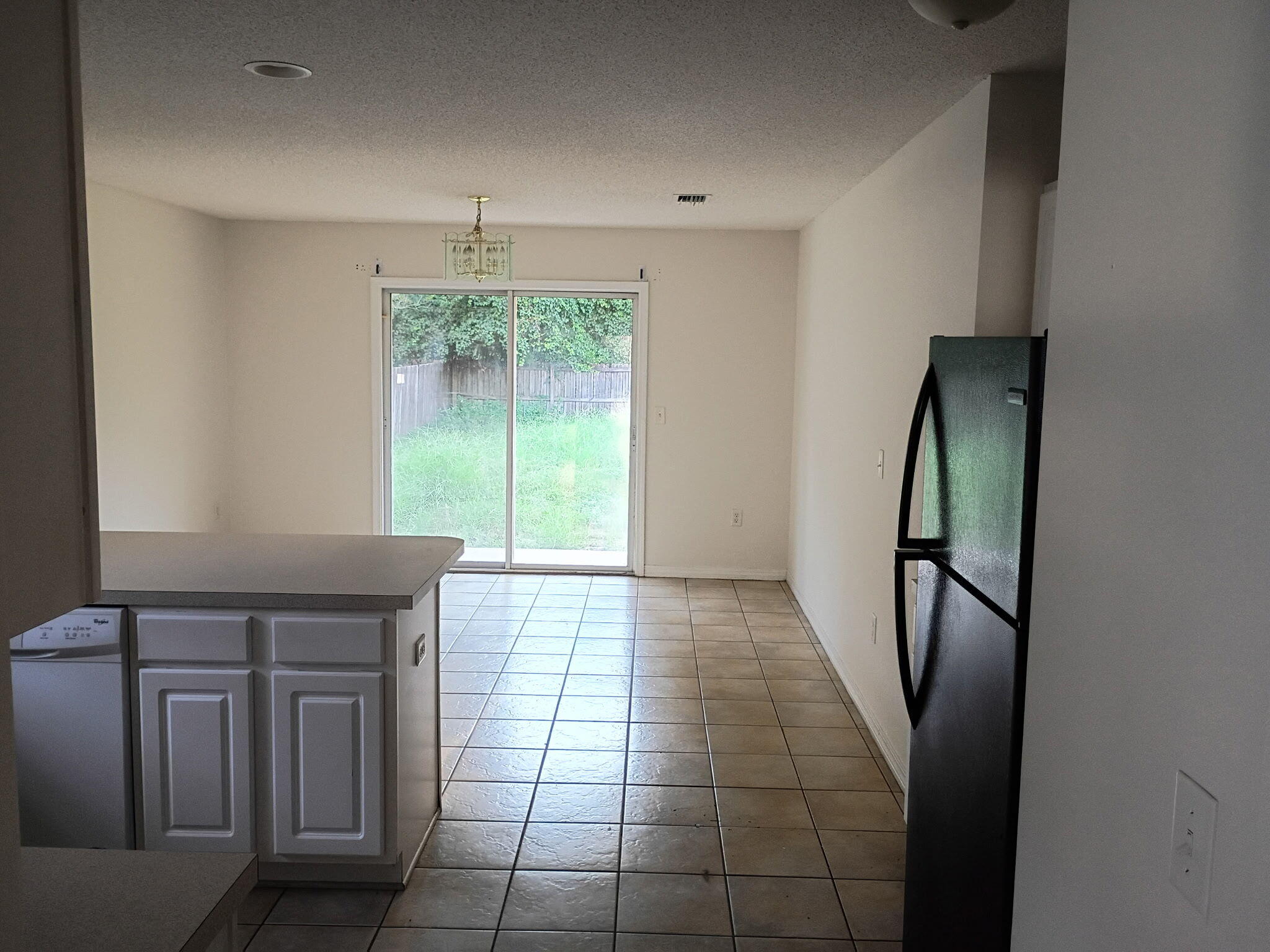 8 Howard Street Niceville, FL 32578 - Photo 8 of 22 wooden floor in an empty room with a window