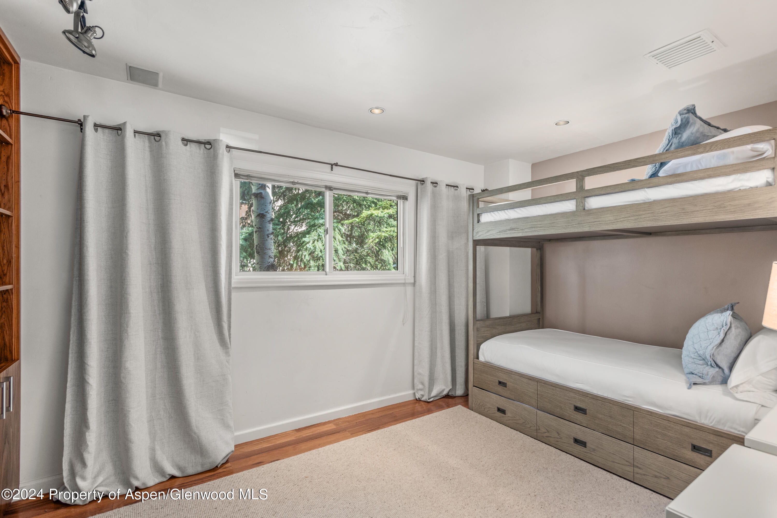 124 East Durant Avenue, Unit 1 Aspen, CO 81611 - Photo 11 of 11 a bedroom with a bed and a window