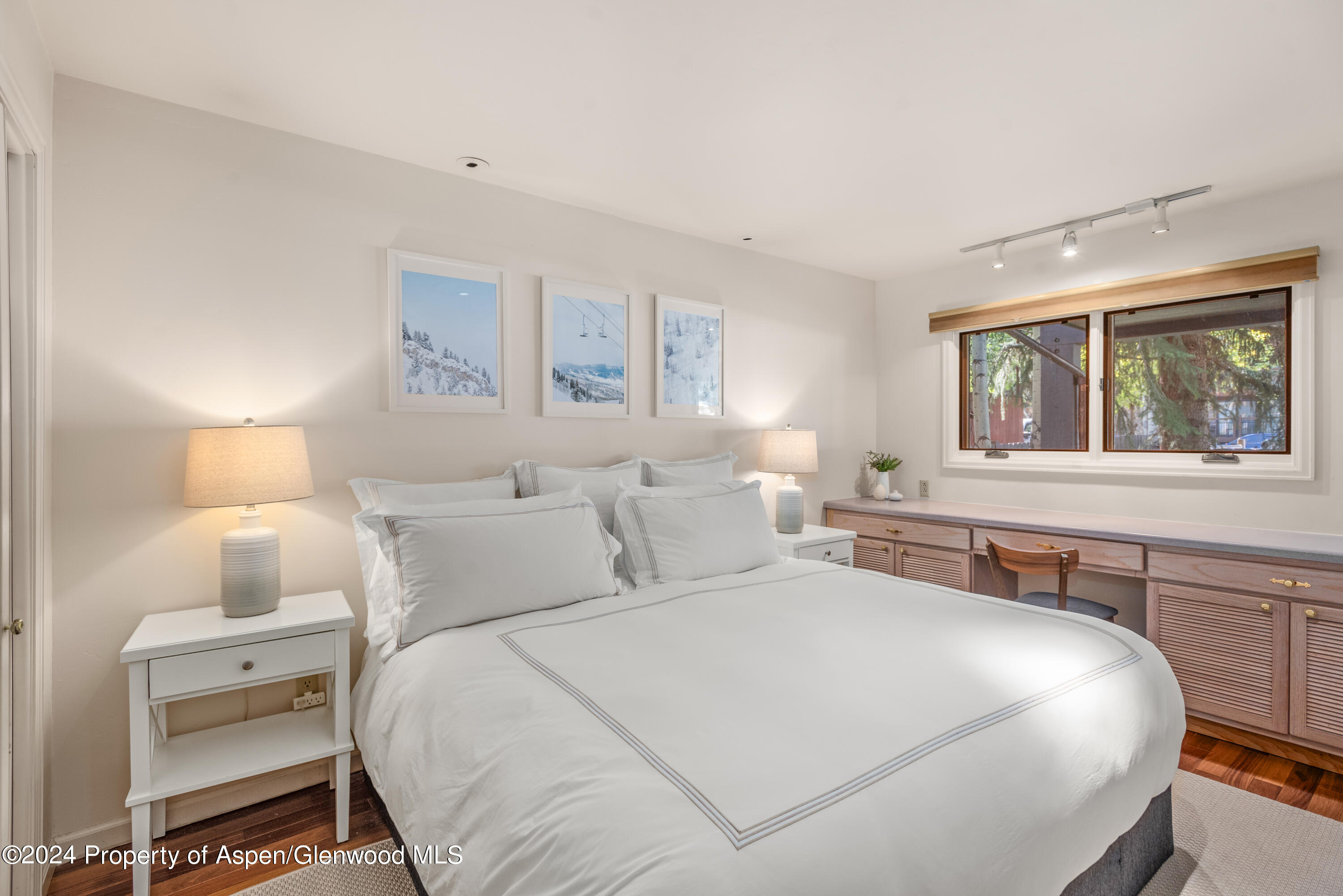 124 East Durant Avenue, Unit 1 Aspen, CO 81611 - Photo 9 of 11 a bedroom with a bed and a window