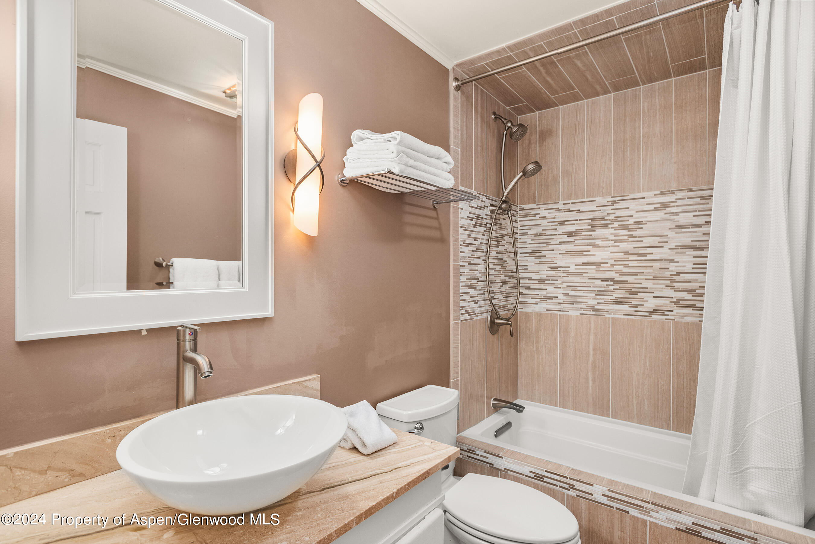 124 East Durant Avenue, Unit 1 Aspen, CO 81611 - Photo 10 of 11 a bathroom with a sink toilet and shower