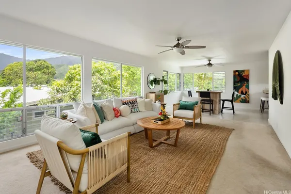 a living room with furniture and a large window