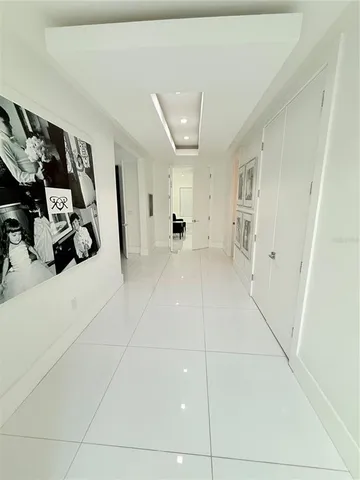 a spacious bathroom with a toilet a sink and a mirror