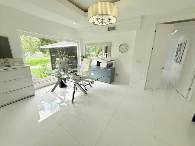 a spacious bedroom with a bed and a couch