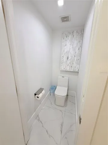 a large white bed in a white room