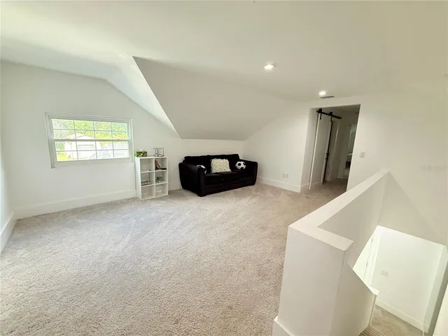 a view of a car parked in the yard