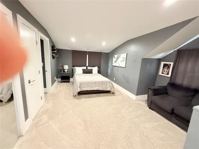 a kitchen with a stove a sink and a wooden cabinets