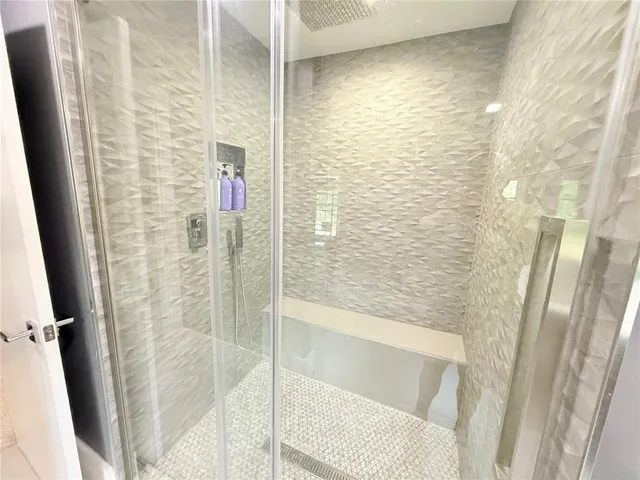 a kitchen with a stove a sink and a window