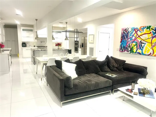 a kitchen that has a sink and a stove in it