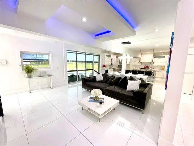 a view of a livingroom with white furniture