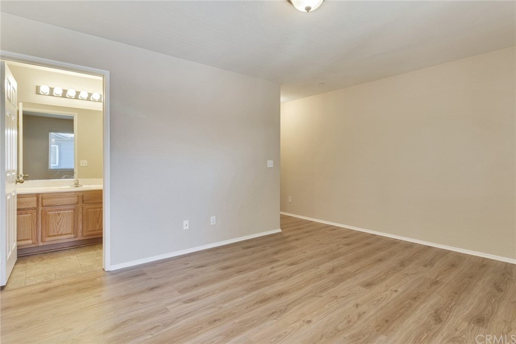 1555 Orange Avenue, Unit 401 Redlands, CA 92373 - Photo 17 of 21 a view of an empty room with a kitchen