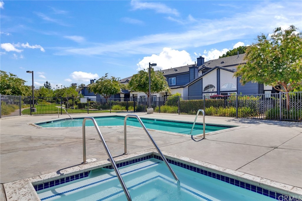 1555 Orange Avenue, Unit 401 Redlands, CA 92373 - Photo 20 of 21 a park view with a bench in front of it