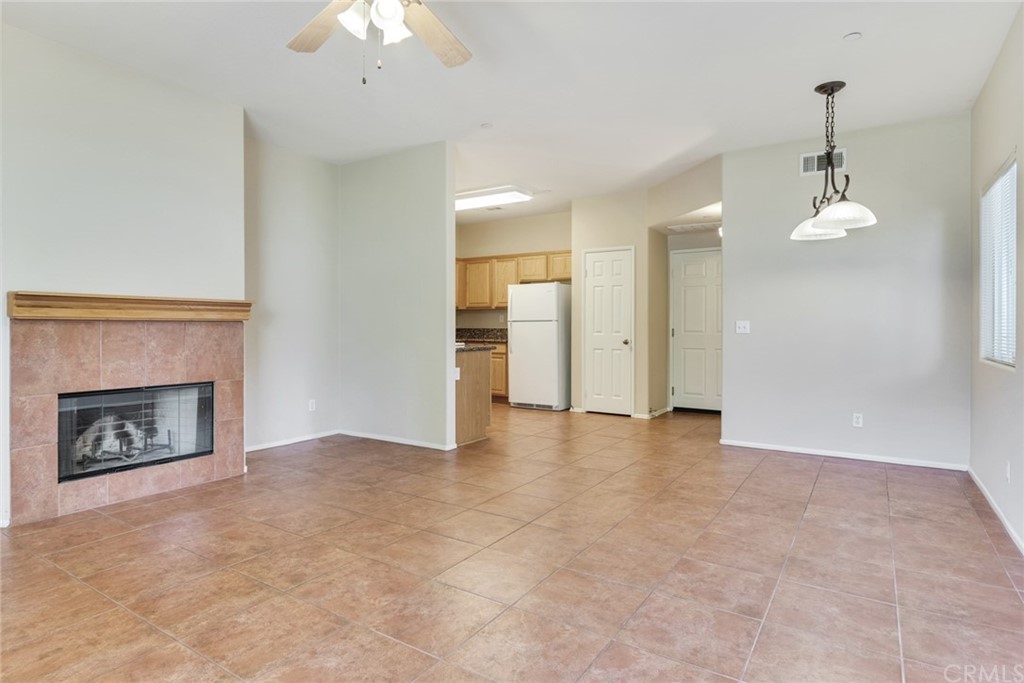 1555 Orange Avenue, Unit 401 Redlands, CA 92373 - Photo 5 of 21 a view of an empty room with a fireplace