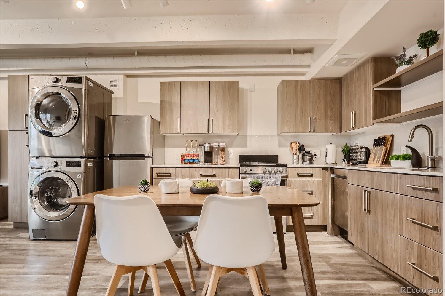 1495 Vrain Street, Unit 218 Denver, CO 80204 - Photo 1 of 5 a kitchen with a sink cabinets and appliances