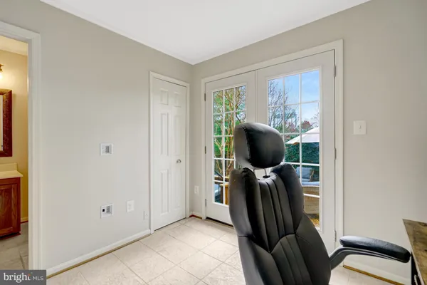 a bedroom with a bed and a ceiling fan