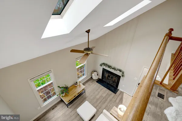 a living room with furniture and a wall painting