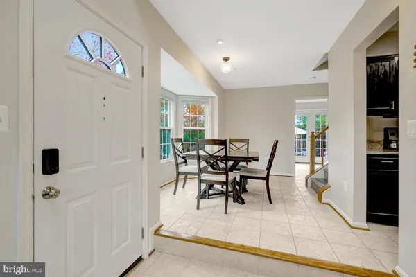 a living room with furniture a window and a fireplace