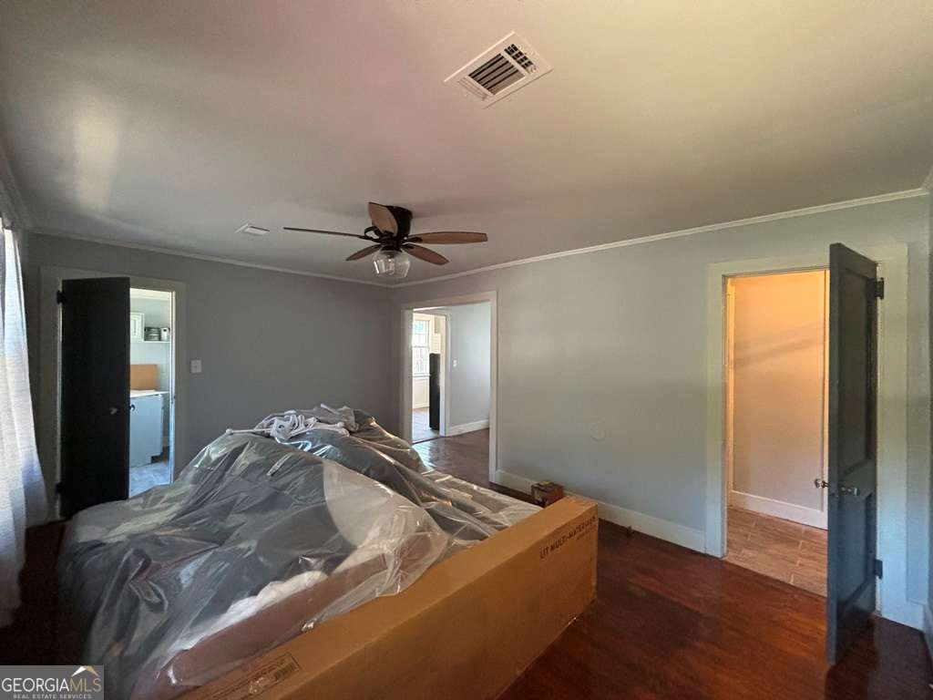 13162 Augusta Highway Sparta, GA 31087 - Photo 13 of 28 a living room with a bed furniture and a window