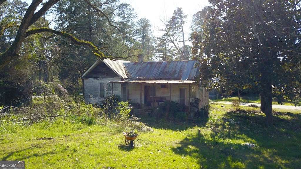 13162 Augusta Highway Sparta, GA 31087 - Photo 5 of 28 a view of a back yard with green space