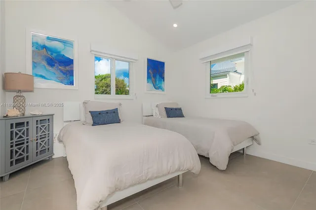 a bedroom with bed and a night stand