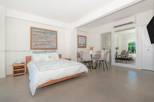 a bedroom with a bed and a table