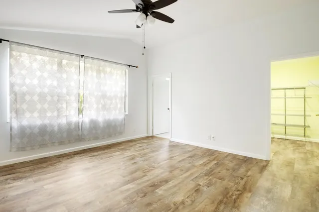 a view of an empty room with a window