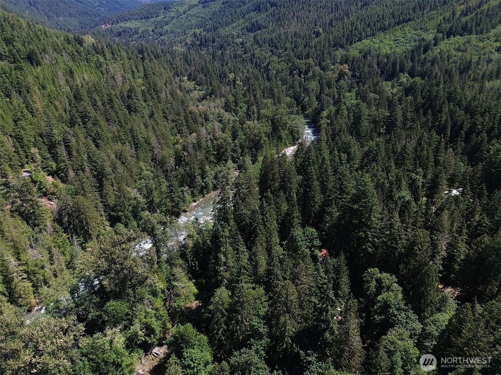 0 Cascade River Road, Unit D1203 Marblemount, WA 98267 - Photo 22 of 32 an aerial view of residential house with outdoor space and trees all around
