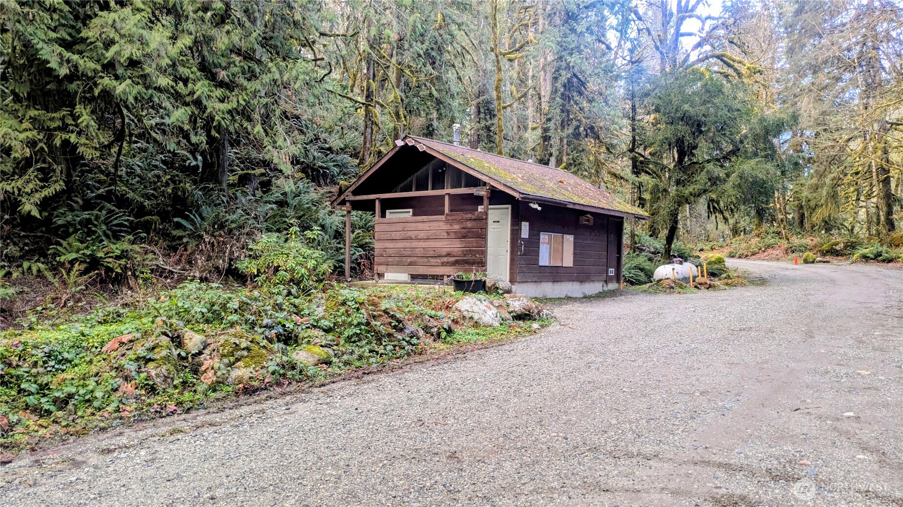 0 Cascade River Road, Unit D1203 Marblemount, WA 98267 - Photo 29 of 32 a front view of a house with a yard