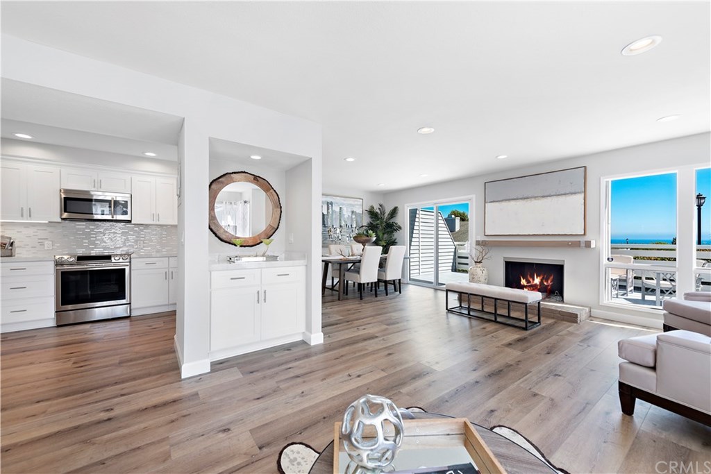 24592 Harbor View Drive, Unit A Dana Point, CA 92629 - Photo 2 of 32 The open floor creates a wonderful flow between the kitchen, living room and dining room.