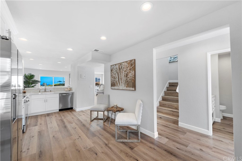 24592 Harbor View Drive, Unit A Dana Point, CA 92629 - Photo 11 of 32 Beautiful wood grain Luxury Vile Tile and baseboards were installed through out the entire home while being renovated.