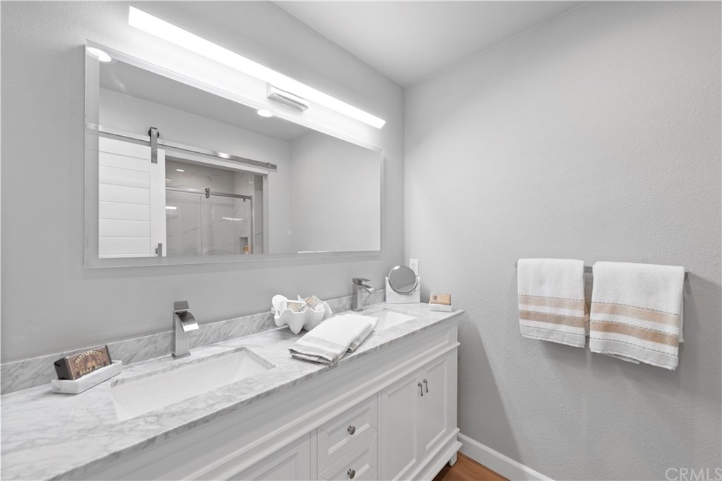 24592 Harbor View Drive, Unit A Dana Point, CA 92629 - Photo 16 of 32 Brand new Duel sink vanity with marble counter in master bath.