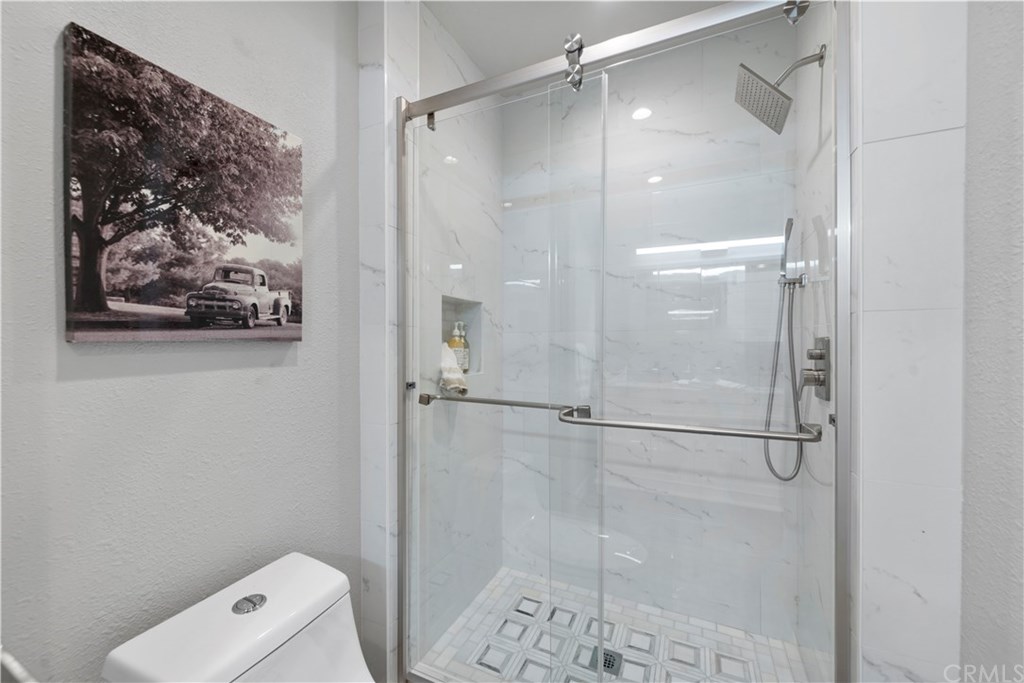 24592 Harbor View Drive, Unit A Dana Point, CA 92629 - Photo 17 of 32 Duel shower head in gorgeous porcelain shower & commode in master bath.