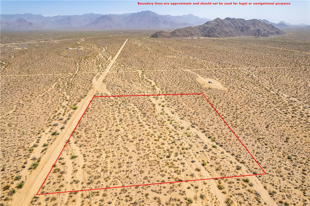 0 East Arroyo Road Yucca, AZ 86438 - Photo 9 of 25 Expansive desert property with a natural landscape, offering views of distant mountains