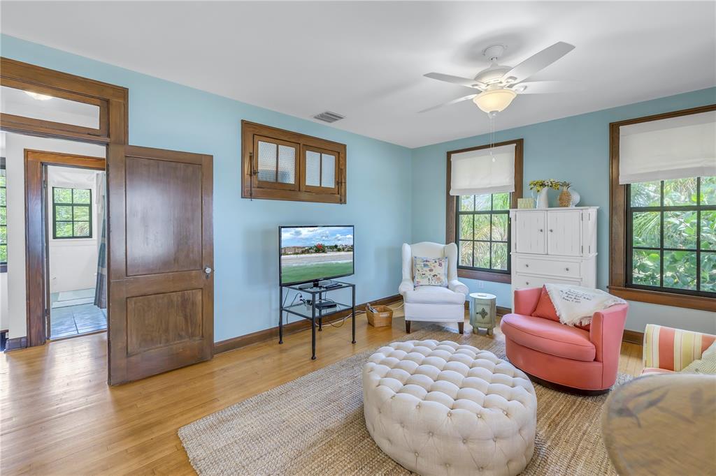 516 Gulf Boulevard Indian Rocks Beach, FL 33785 - Photo 39 of 97 a living room with furniture and a wooden floor