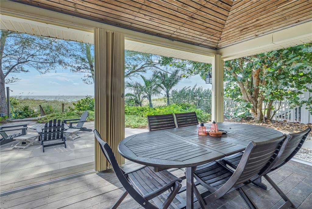 516 Gulf Boulevard Indian Rocks Beach, FL 33785 - Photo 49 of 97 a view of a dining room with furniture window and outside view
