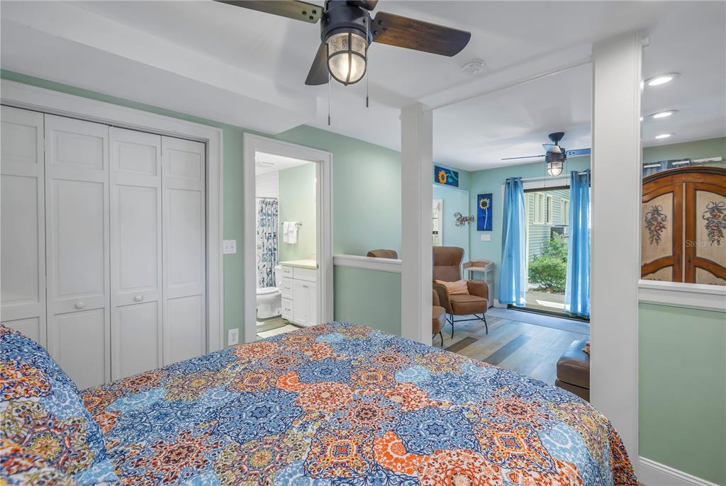 516 Gulf Boulevard Indian Rocks Beach, FL 33785 - Photo 67 of 97 a bedroom with furniture window and a chandelier