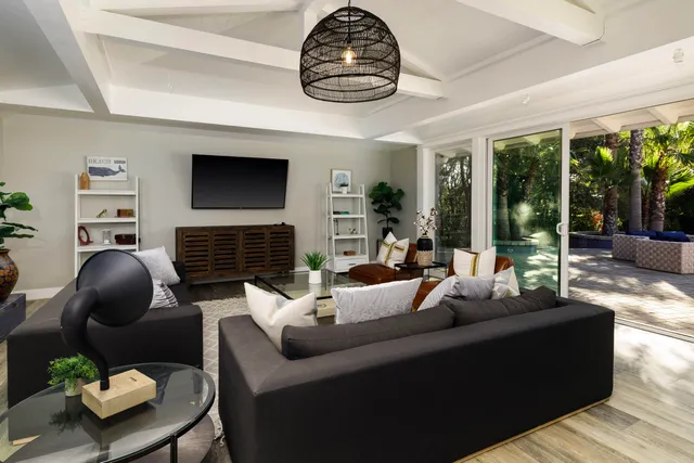 a living room with fireplace furniture and a flat screen tv
