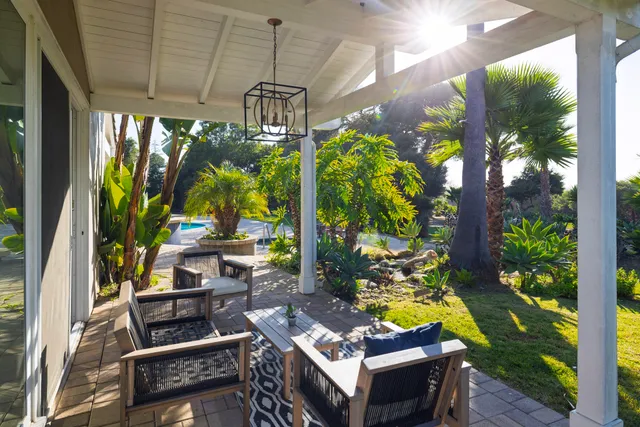 a view of a chairs and table in a patio