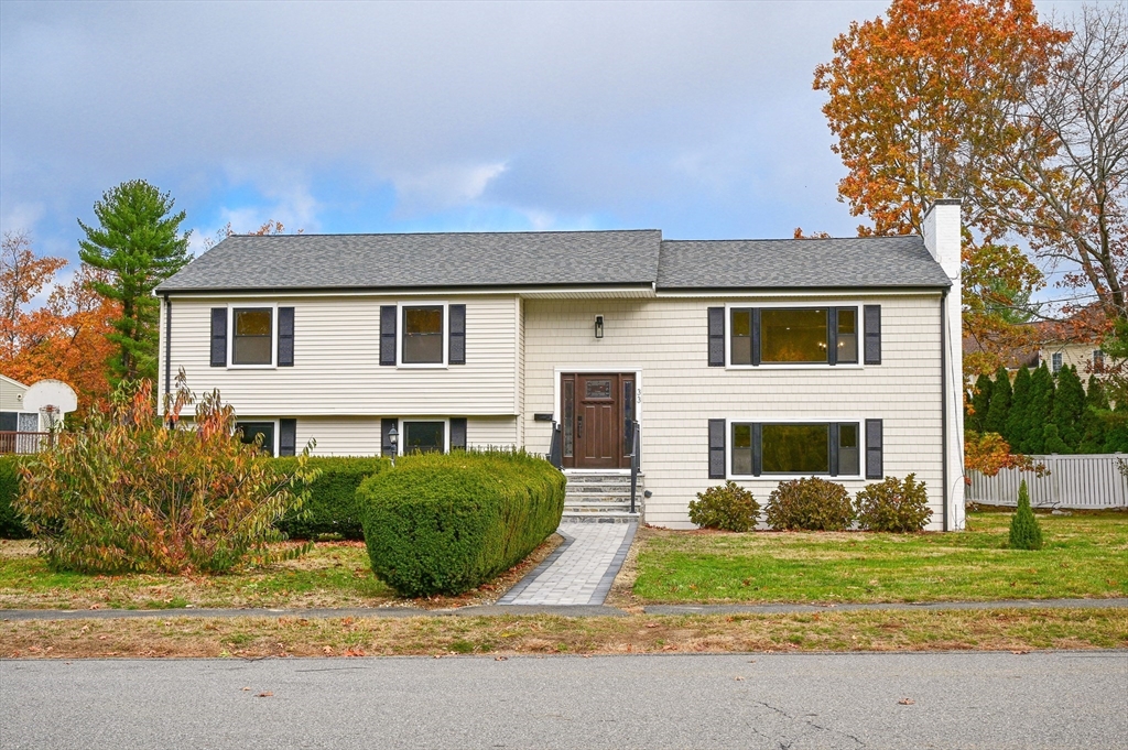 33 Marla Lane Reading, MA 01867 - Photo 1 of 42 a view of a house with a yard and plants
