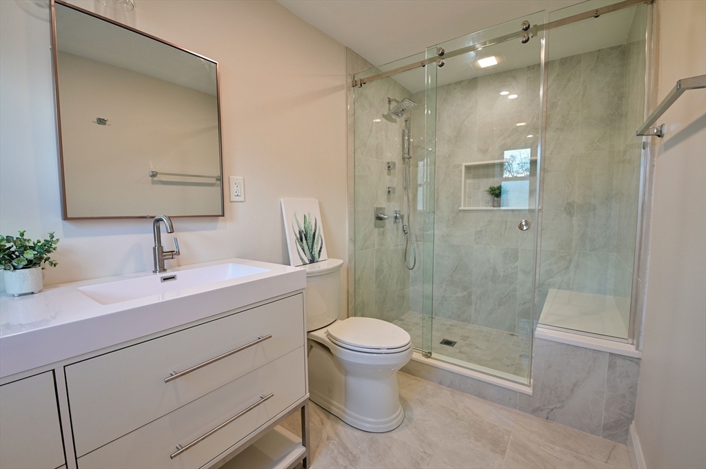 33 Marla Lane Reading, MA 01867 - Photo 17 of 42 a bathroom with a sink a toilet and shower