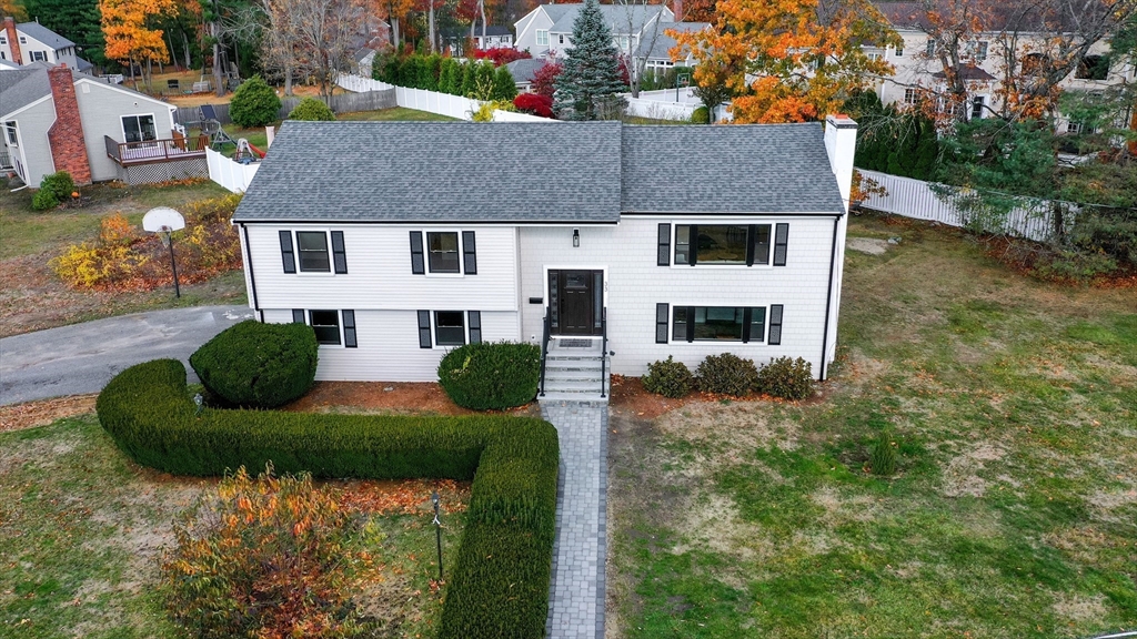 33 Marla Lane Reading, MA 01867 - Photo 3 of 42 a aerial view of house with yard and green space