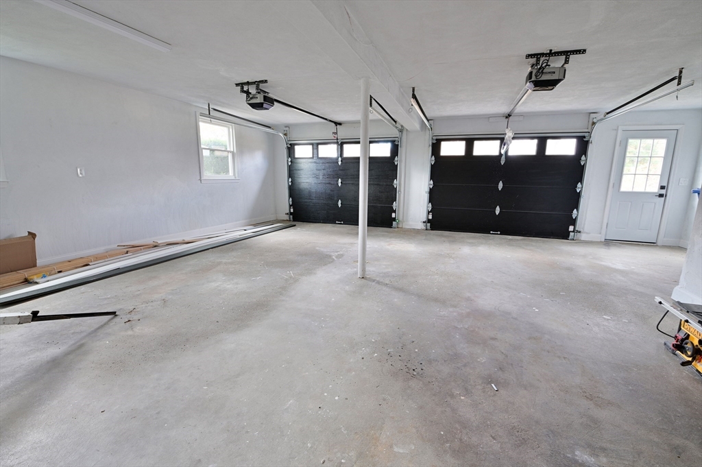 33 Marla Lane Reading, MA 01867 - Photo 34 of 42 a view of a livingroom with furniture and windows