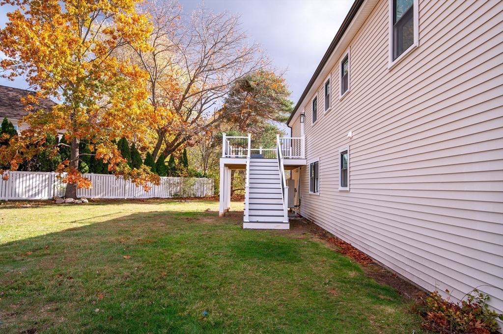 33 Marla Lane Reading, MA 01867 - Photo 37 of 42 a view of a backyard with a large tree