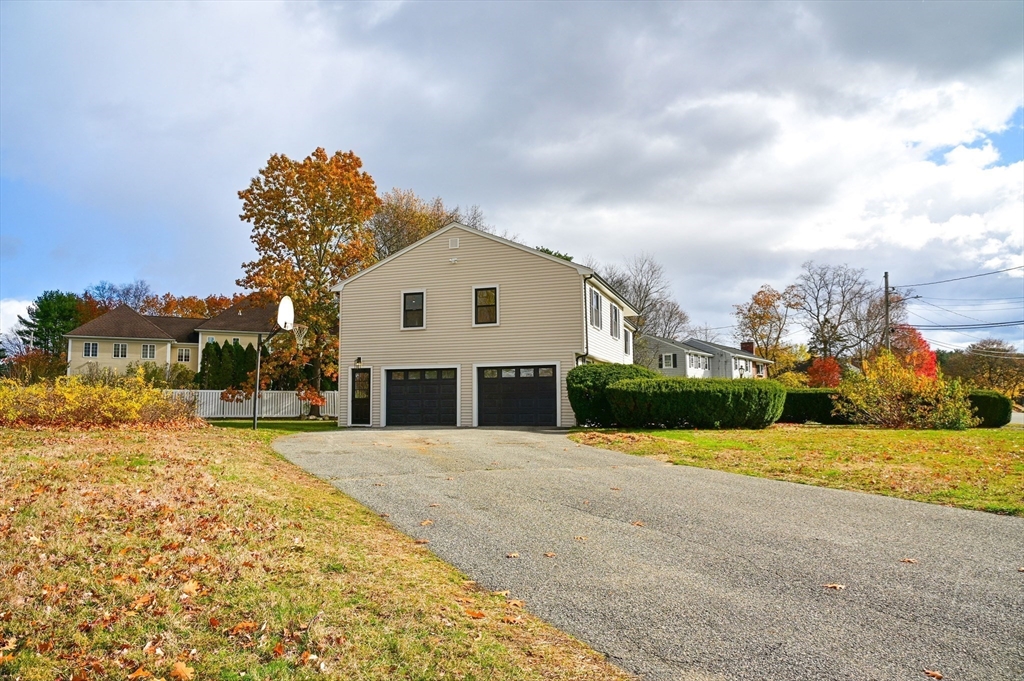 33 Marla Lane Reading, MA 01867 - Photo 40 of 42 a view of a house with a yard