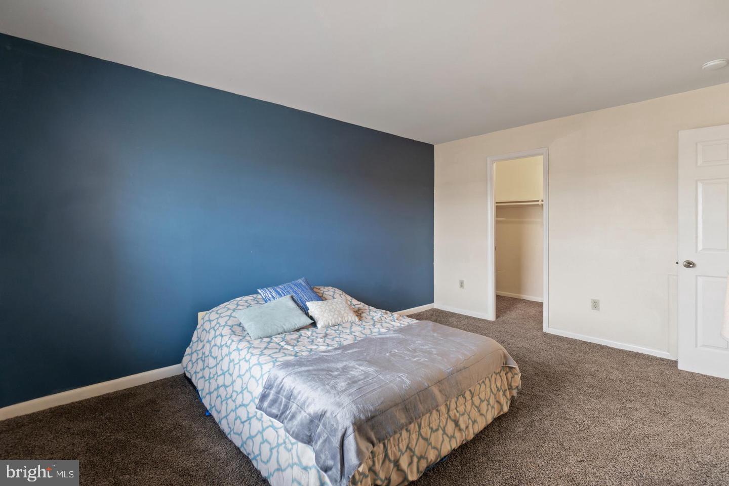 3807 St Barnabas Road, Unit 203 Suitland, MD 20746 - Photo 14 of 20 Cozy bedroom with a bold accent wall.