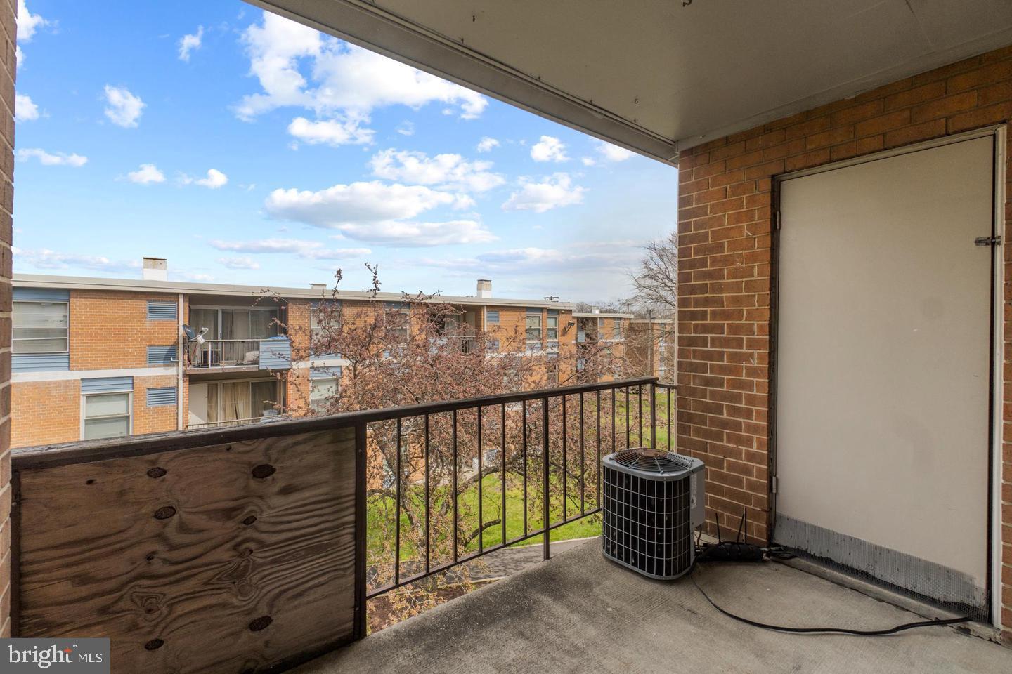 3807 St Barnabas Road, Unit 203 Suitland, MD 20746 - Photo 20 of 20 Sunny balcony with serene views.