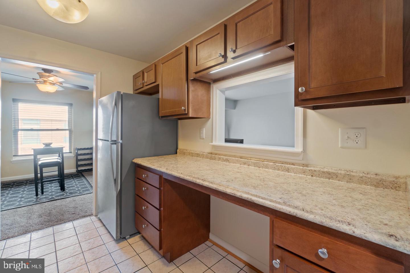 3807 St Barnabas Road, Unit 203 Suitland, MD 20746 - Photo 6 of 20 Modern kitchen with warm wood accents.